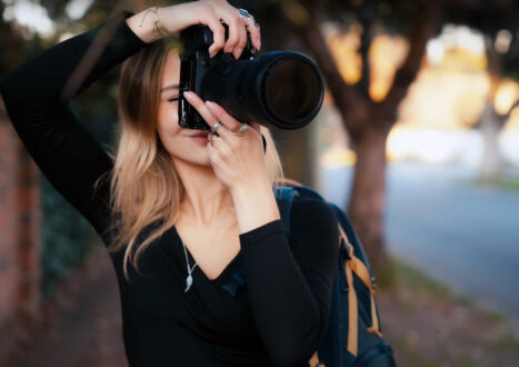 BEST CAMERA BAGS - Faye shooting canon camera