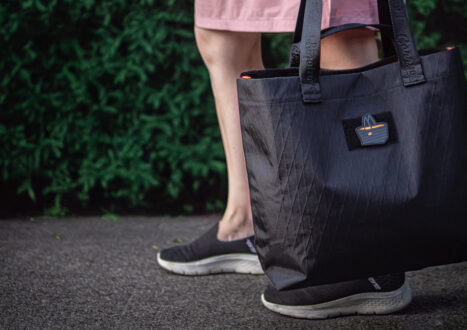lady carrying black x-pac tote